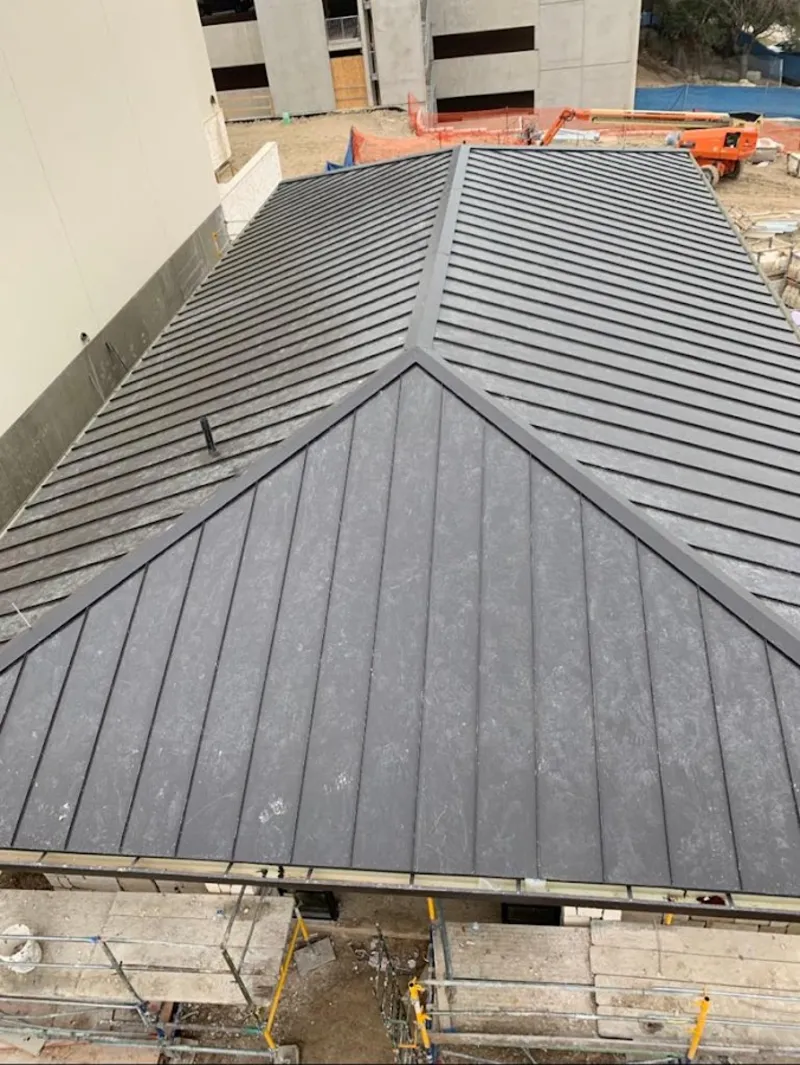 Commercial metal roof construction with crane equipment in Marion Oaks