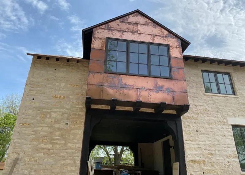 Copper metal panel facade on a stone building for Metal Roof Coating in Marion Oaks