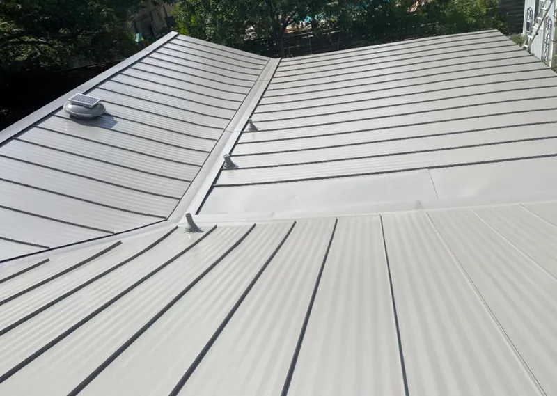 Solar attic fan installed on a metal roof for Roof Ventilation in Marion Oaks